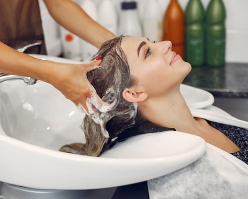 woman-washing-head-hairsalon_1157-27179